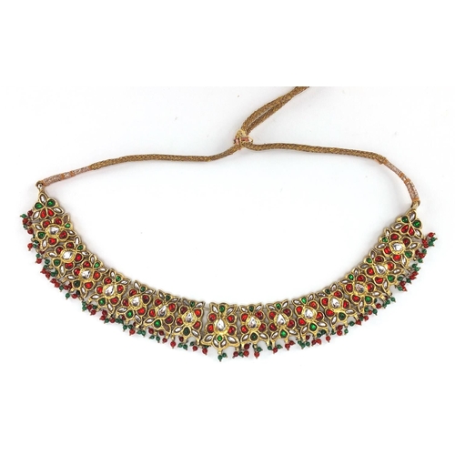 481 - Indian? gilt metal necklace set with clear red and green stones, 22.5cm wide