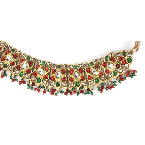 481 - Indian? gilt metal necklace set with clear red and green stones, 22.5cm wide