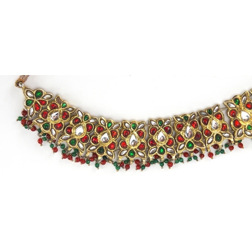 481 - Indian? gilt metal necklace set with clear red and green stones, 22.5cm wide