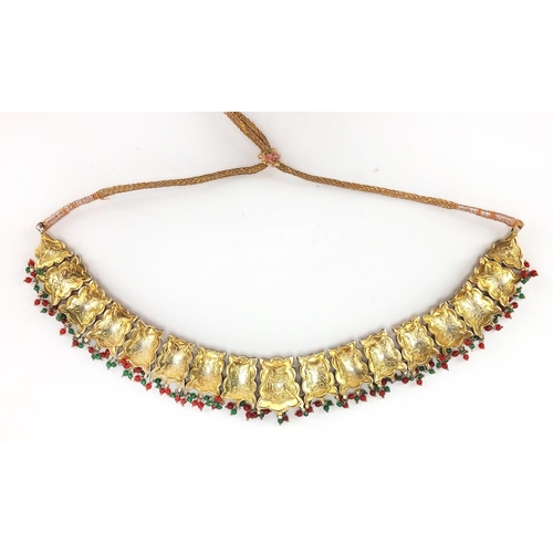 481 - Indian? gilt metal necklace set with clear red and green stones, 22.5cm wide