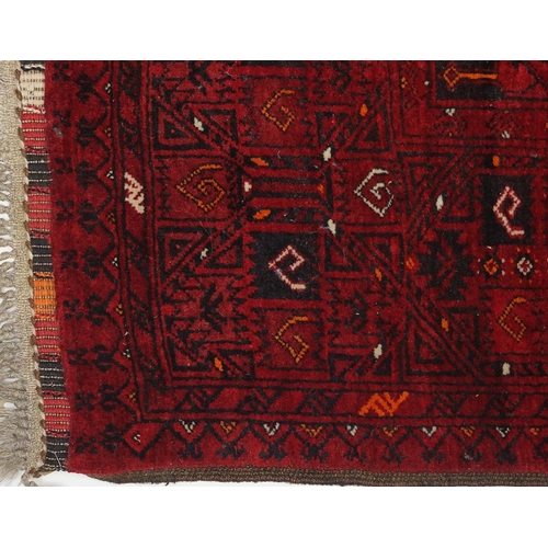2053 - Rectangular Afghan rug with repeat design, approximately 215cm x 130cm