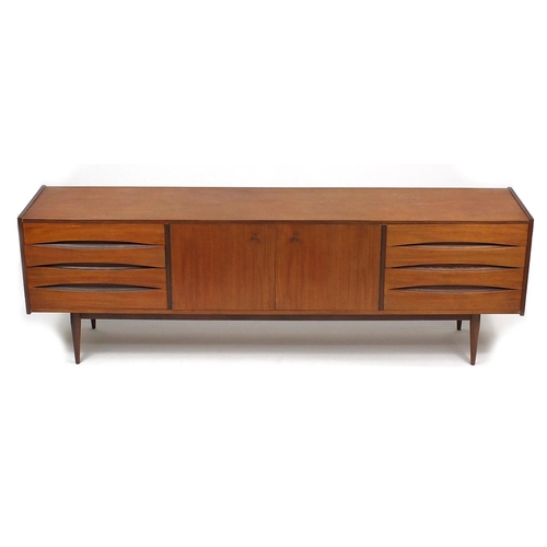 2019 - Vintage teak sideboard, possibly Danish fitted with a pair of cupboard doors and eight drawers, 73cm... 