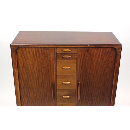 2002 - Danish rosewood compactum by Dyrlund, fitted with two Tambour doors and an arrangement of drawers an... 