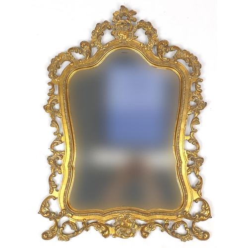 2012 - Rococo style wall hanging mirror, decorated with c-scrolls and foliage, 97cm high x 64cm wide