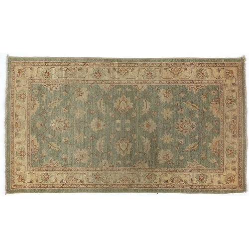 2048 - Rectangular Persian Zeigler rug, having a scrolling vine and flower head design, 157cm x 80cm