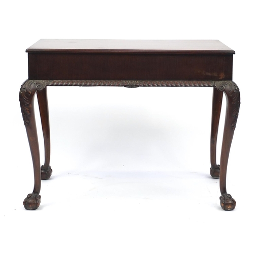 2051 - Mahogany serving table, fitted with two drawers on carved cabriole legs with claw and ball feet, 71c... 