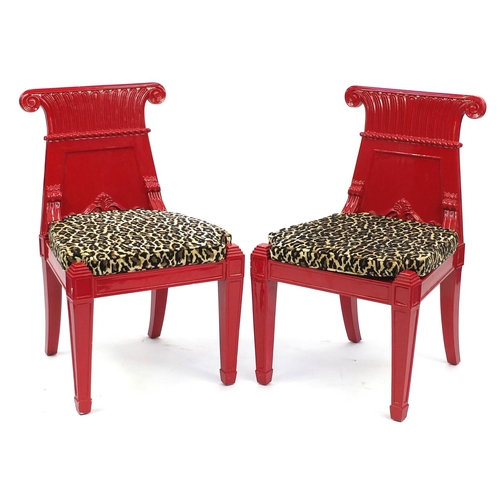 2057 - Pair of Empire influenced red lacquered occasional chairs, with leopard pattern upholstered cushion ... 