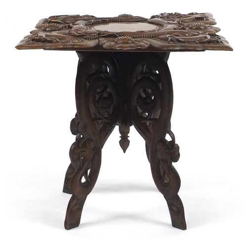 2049 - Chinese hardwood table, the square top deeply carved with two dragons, bats and symbols, 59cm H x 61... 