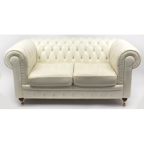 24 - Cream leather Chesterfield settee, 170cm in length