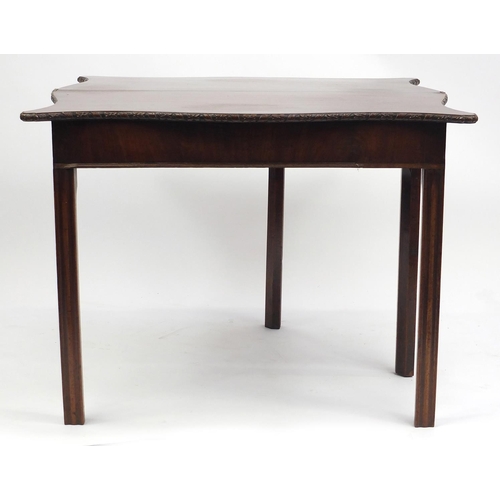 26 - Mahogany folding serving table with serpentine outline, 70cm high x 90cm wide