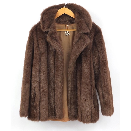 592 - Ladies cream fur coat and brown fur jacket