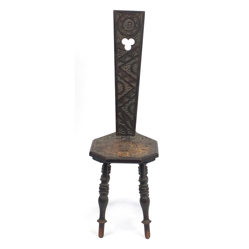 145 - Victorian carved oak three legged chair