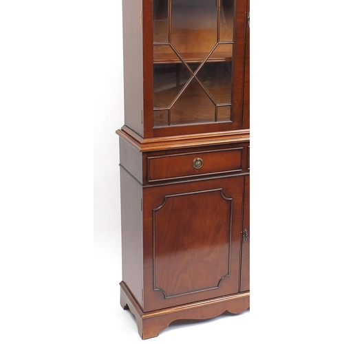 66 - Mahogany bookcase fitted with a pair of glazed doors, above a pair of drawers and cupboard doors, 18... 