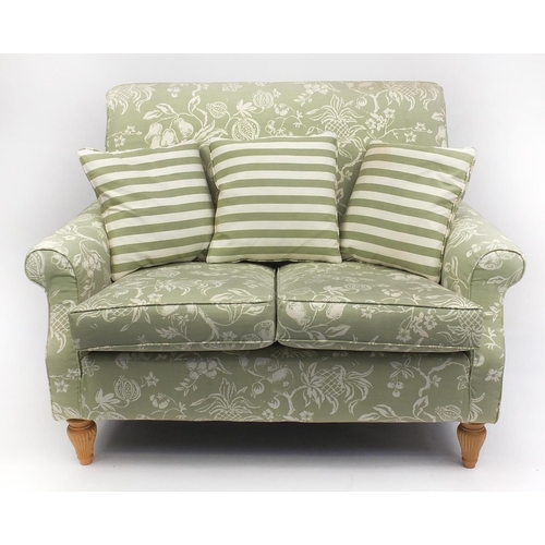 63 - Two seater settee and armchair with green fruit upholstery