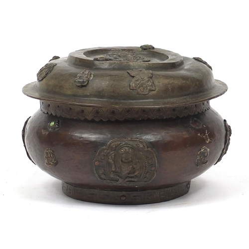 484 - Chinese bronzed metal bowl and cover, decorated in relief with figures, 15cm high x 22cm in diameter