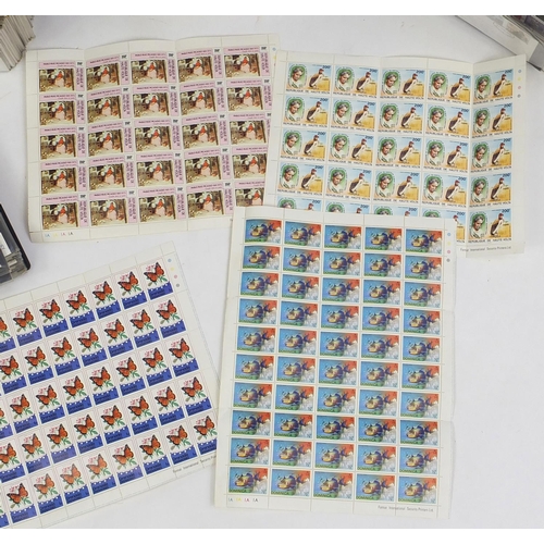 717 - First day covers arranged in three albums and a selection of stamp sheets