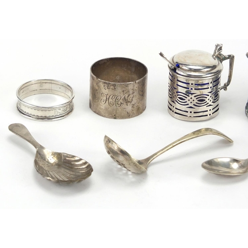 539 - Silver and white metal items including a silver mustard with blue glass liner and napkin rings