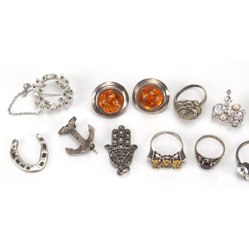 379 - Silver and white metal jewellery including amber earrings, rings and charms, approximate weight 61.5... 