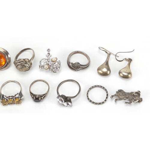 379 - Silver and white metal jewellery including amber earrings, rings and charms, approximate weight 61.5... 