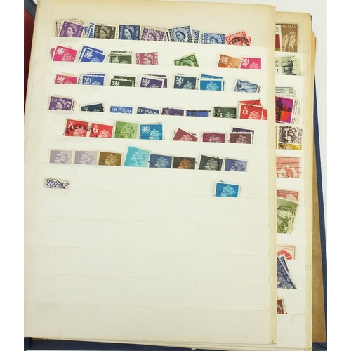 694 - British stamps arranged in an album and stock book, some mint unused