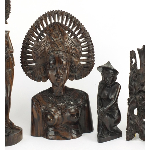 250 - Six Balinese hardwood carvings including a nude female, the largest 39cm high