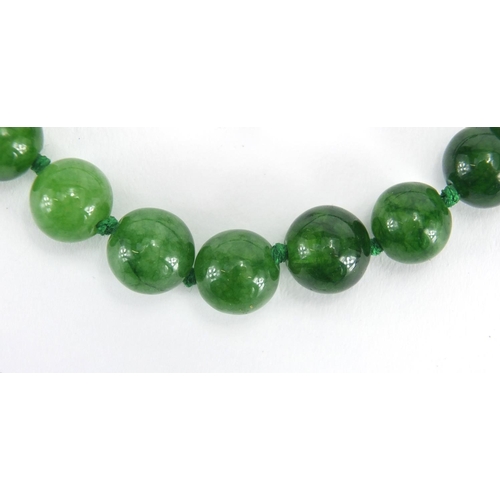 371 - Chinese green jade bead necklace, 40cm in length