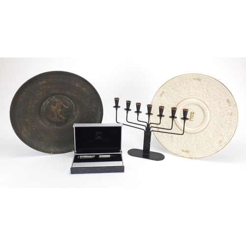 583 - Jewish items including a bronzed metal charger, boxed pen and a candelabra