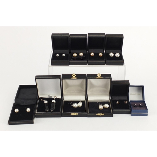 527 - Ten pairs of silver and pearl earrings, with fitted boxes