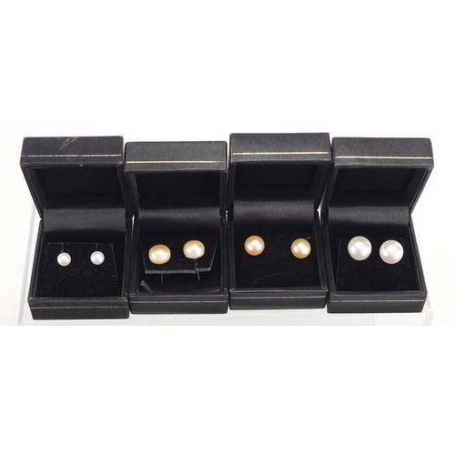 527 - Ten pairs of silver and pearl earrings, with fitted boxes