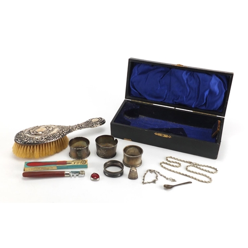 531 - Silver items including napkin rings, silver backed brush, necklace and a thimble