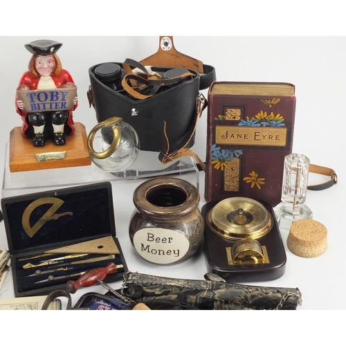 664 - Box of objects including a mantel clock, Toby Bitter advertising figure, postcards and a pair of bin... 