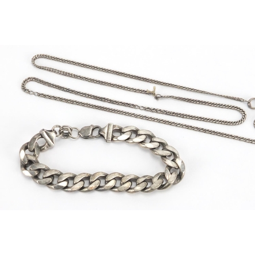 355 - Gentleman's silver curb link bracelet and a silver watch chain, approximate weight 82.5g