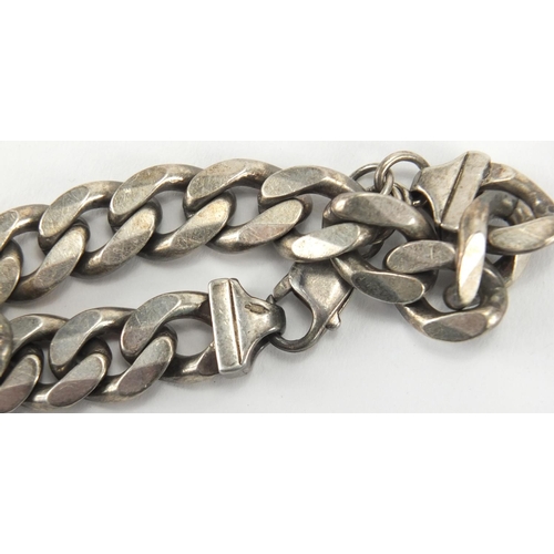 355 - Gentleman's silver curb link bracelet and a silver watch chain, approximate weight 82.5g