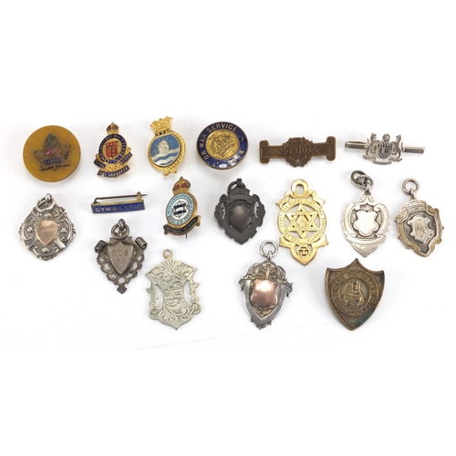 549 - Military and sporting jewels including silver examples