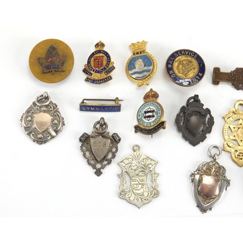 549 - Military and sporting jewels including silver examples