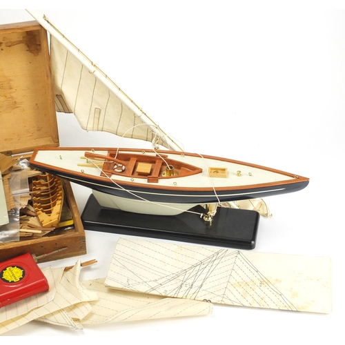 577 - Wooden model boat and a model boat kit