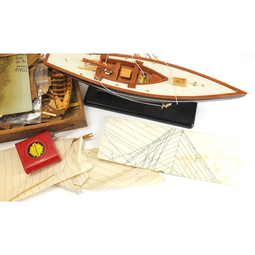 577 - Wooden model boat and a model boat kit