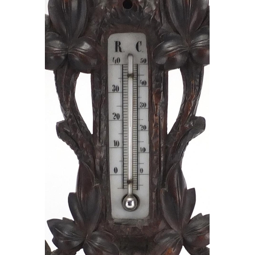 289 - Carved Black forest barometer, the dial marked F.Majer-Strassburg, 40cm high