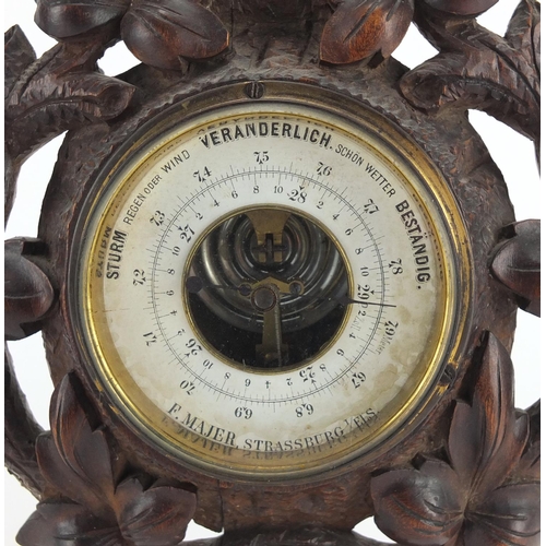 289 - Carved Black forest barometer, the dial marked F.Majer-Strassburg, 40cm high