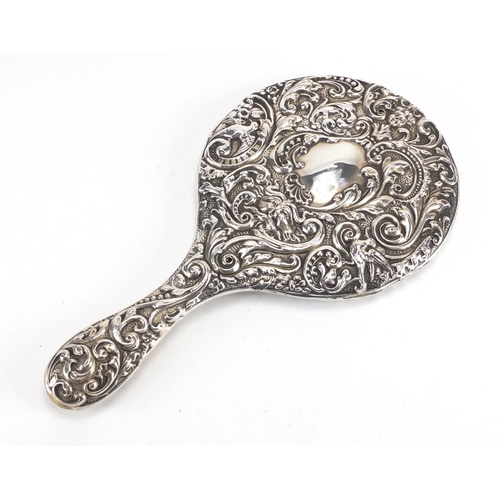 536 - Victorian silver back hand mirror profusely embossed with birds amongst flowers, Birmingham hallmark... 