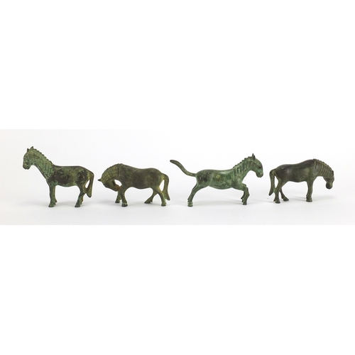 559 - Four archaic style cast metal horses, the largest 10.5cm in length