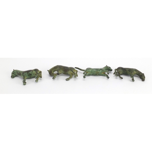 559 - Four archaic style cast metal horses, the largest 10.5cm in length