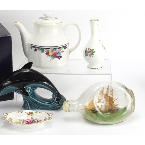 522 - Collectable china including a pair of Poole dolphins, a boxed Royal Doulton teapot and a ship in a b... 