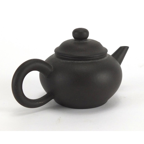 654 - Miniature Oriental terracotta teapot, 8.5cm in length