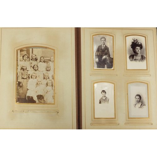 727 - Two Victorian photograph albums, with a selection of photographs and cabinet cards