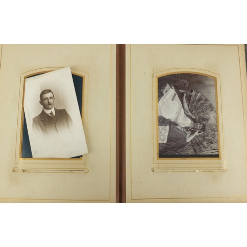 727 - Two Victorian photograph albums, with a selection of photographs and cabinet cards