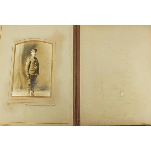 727 - Two Victorian photograph albums, with a selection of photographs and cabinet cards