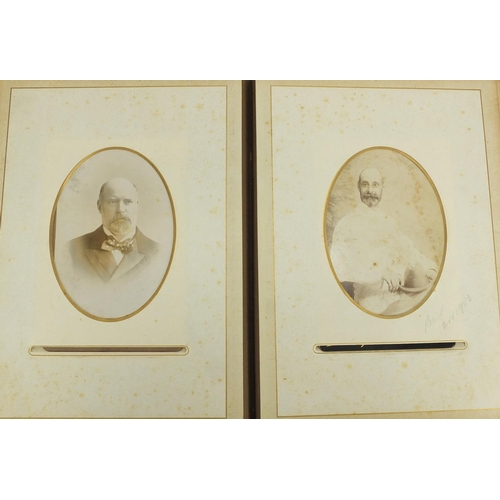 727 - Two Victorian photograph albums, with a selection of photographs and cabinet cards