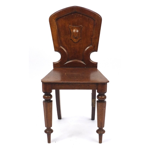 43 - Victorian oak shield back hall chair, 85cm high