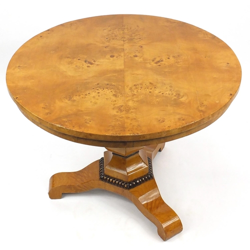 93 - Circular birdseye maple pedestal centre table, 75cm high x 100cm in diameter